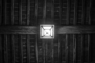 Full frame shot of illuminated light bulb in building