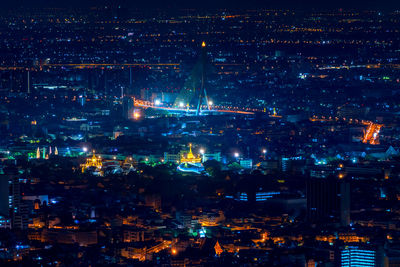 Aerial view of bangkok with golden mount, temples and democracy monument and rama 8 bridge.