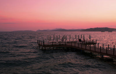 Scenic view of sea and mountains during sunset