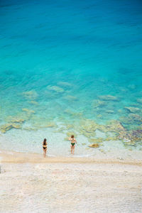 People standing on beach