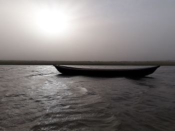 Boat in sea against sky