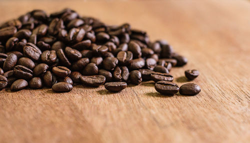 Close-up of coffee beans on table