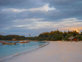 Scenic view of beach against sky during sunset