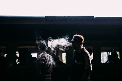 Men standing in front of building