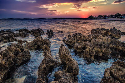 Scenic view of sea against dramatic sky