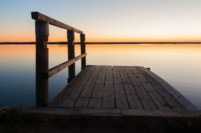 Small wooden jetty at sunset