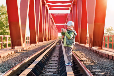 Man walking on railroad track