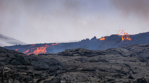 Scenic view of volcanic mountain against sky