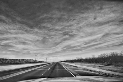 Highway by road against sky