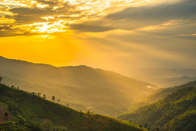 Scenic view of mountains against sky during sunset