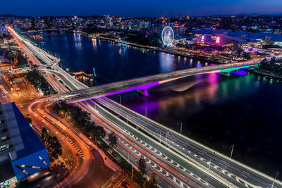 Aerial view of illuminated city at night