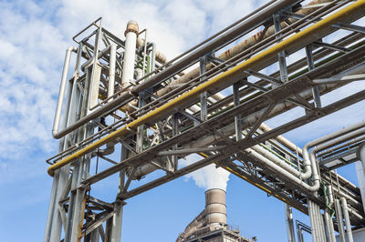 Low angle view of metallic structure against sky