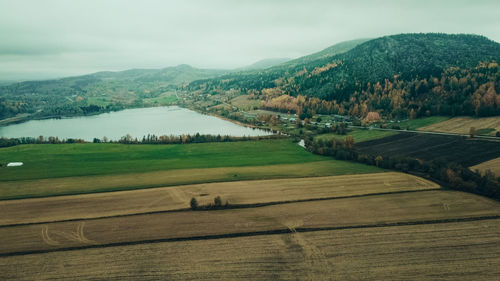 Scenic view of agricultural field against sky