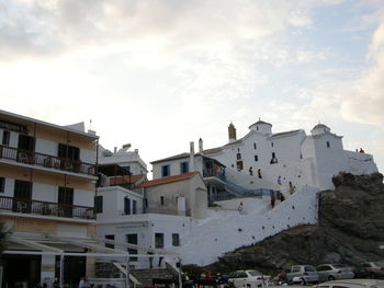 Buildings against cloudy sky