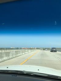 Cars on road against sky