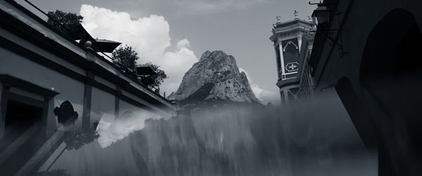 Low angle view of buildings against sky during winter