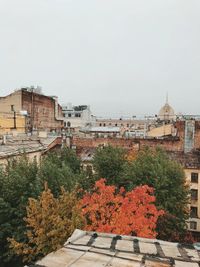 Buildings against sky during autumn