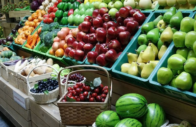 Various fruits in basket at market stall