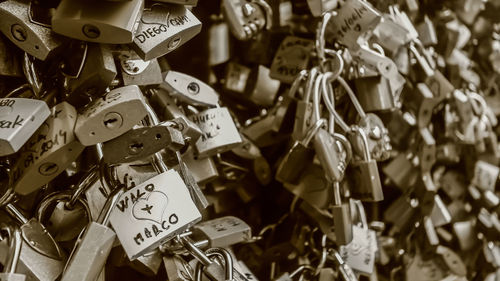 Close-up of padlocks hanging on metal