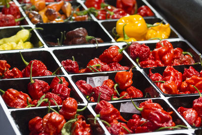 Spicy chili peppers of various colors, sold at market