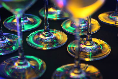 Close-up of illuminated glasses on table