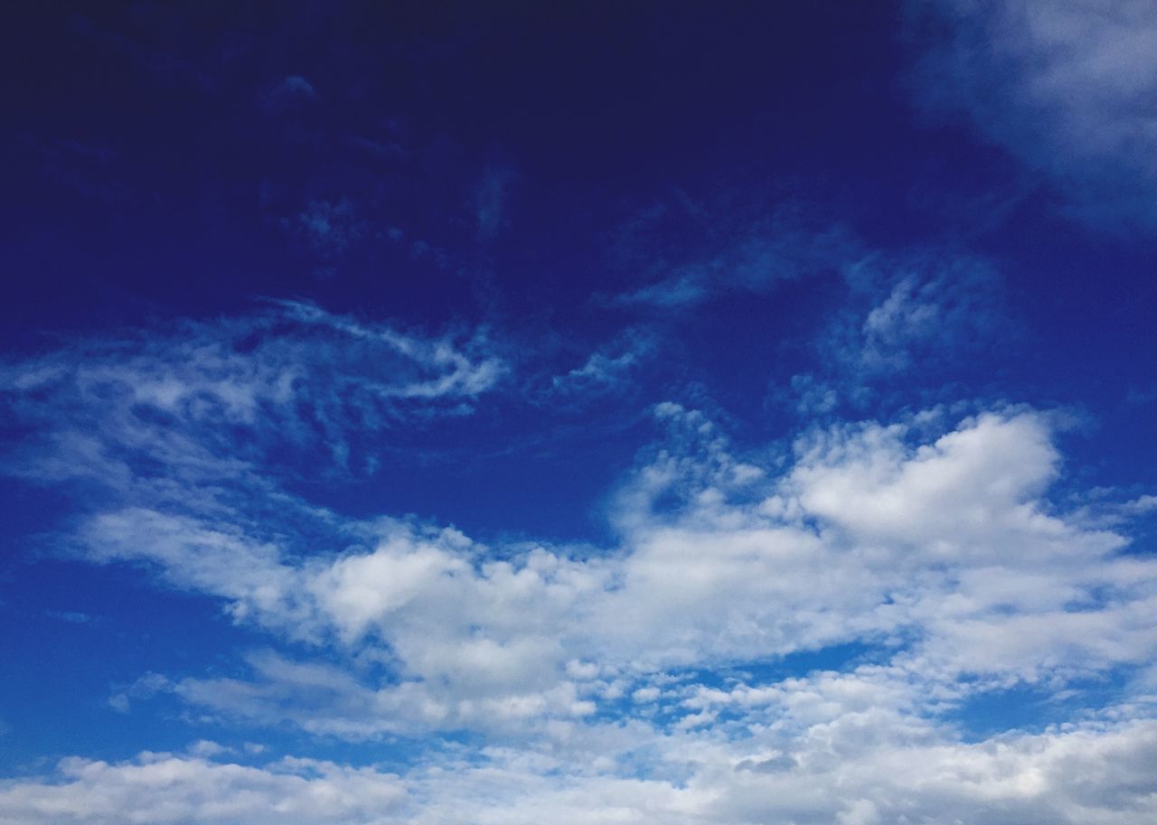 low angle view, sky, blue, sky only, beauty in nature, cloud - sky, tranquility, nature, scenics, backgrounds, tranquil scene, full frame, cloudscape, cloudy, idyllic, cloud, outdoors, white color, no people, day