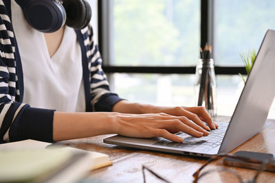 Midsection of businessman working at office