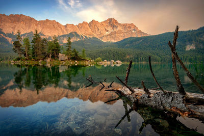 Scenic view of lake and mountains against sky