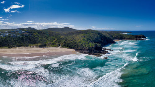 Scenic view of sea against blue sky