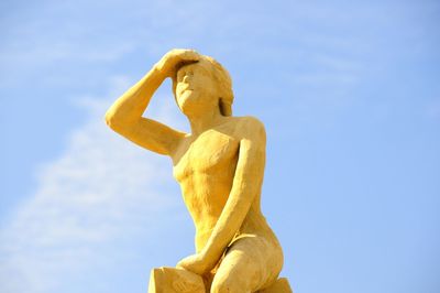 Low angle view of statue against sky