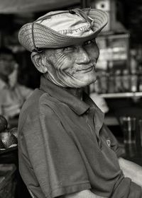 Portrait of senior man wearing hat