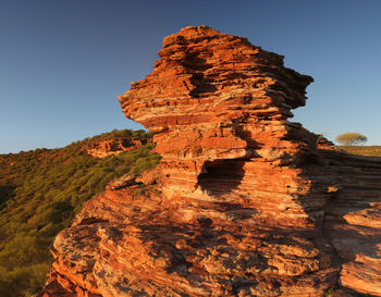 Low angle view of rock formations against sky