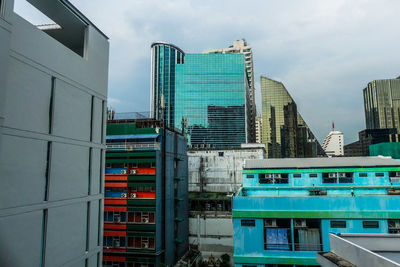 Modern buildings against sky in city