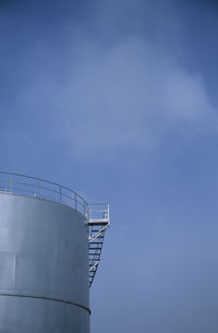 Low angle view of factory against sky