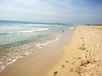 Scenic view of beach against sky