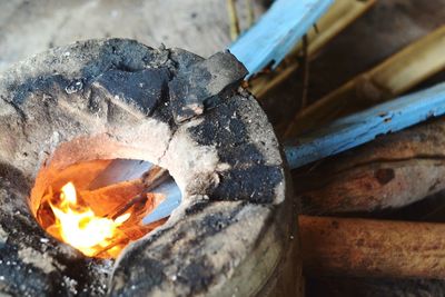 High angle view of burning fire on wood