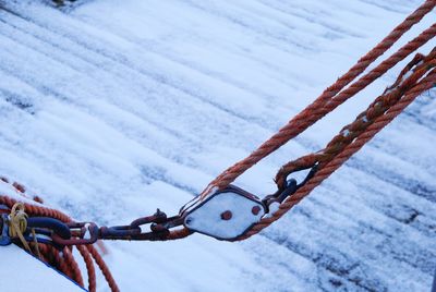 High angle view of pulley over snow covered footpath