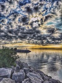Scenic view of sea against cloudy sky