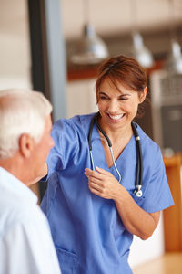 Female doctor examining patient in hospital