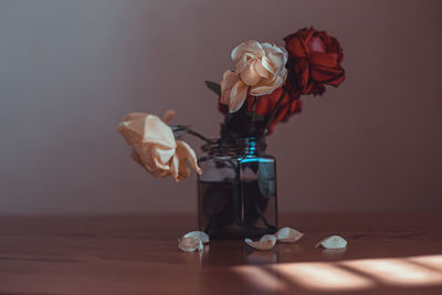 Close-up of roses in vase on table