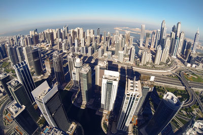 High angle view of modern buildings in city against sky