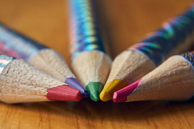 Close-up of multi colored pencils on table