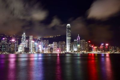 Illuminated city at waterfront