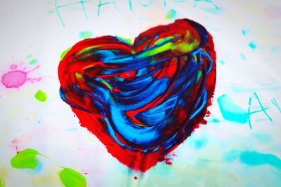 Close-up of heart shape made of multi colored paper