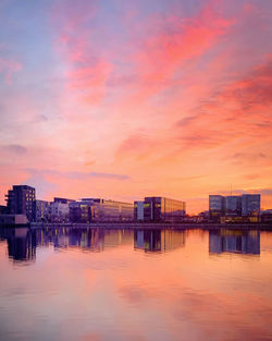 Scenic view of lake against romantic sky at sunset