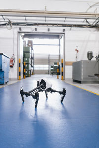 Drone on floor of a factory workshop