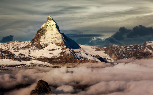 Scenic view of snowcapped mountains against sky