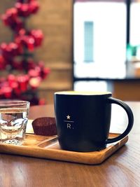 Close-up of coffee cup on table