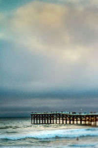 Pier over sea against sky
