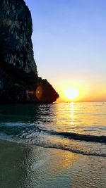 Scenic view of sea against clear sky during sunset